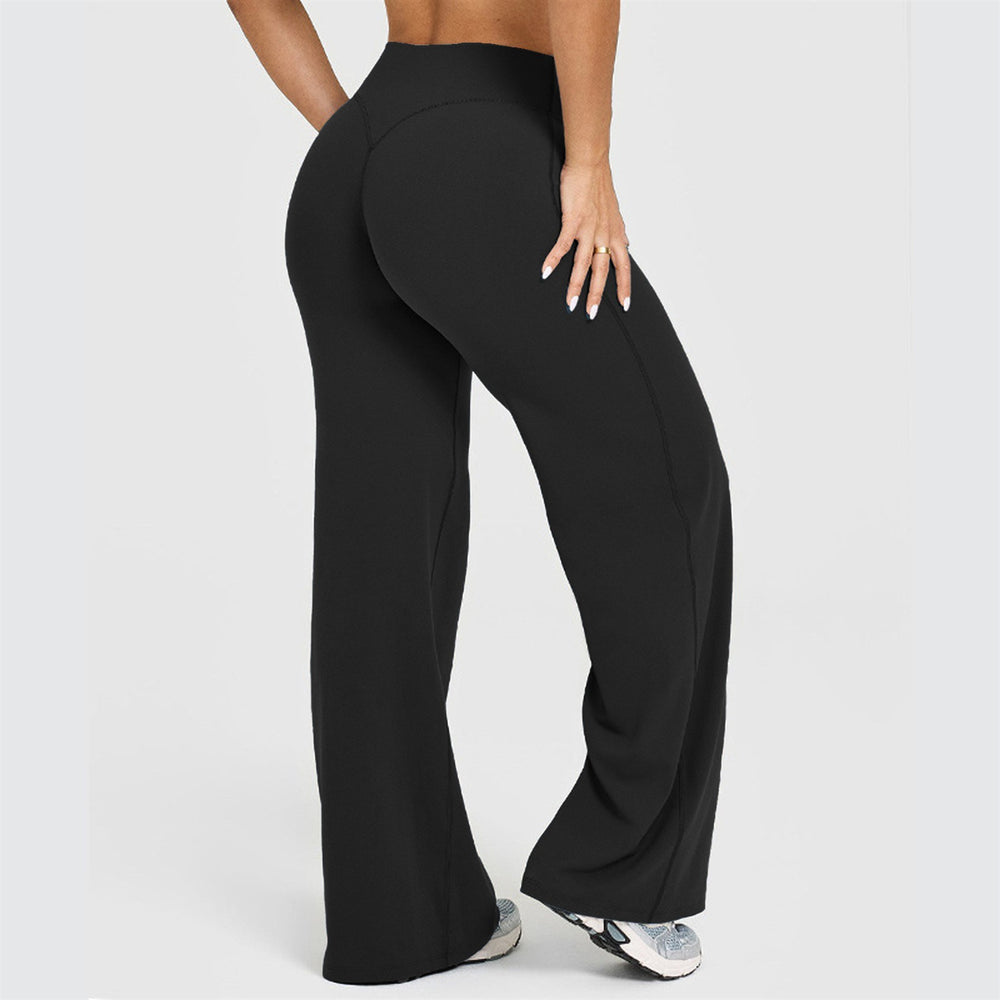 Wide-leg yoga pants in Black, back view showing the curved waistband seam