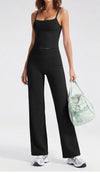 Wide-leg yoga pants in Black worn full length with sneakers