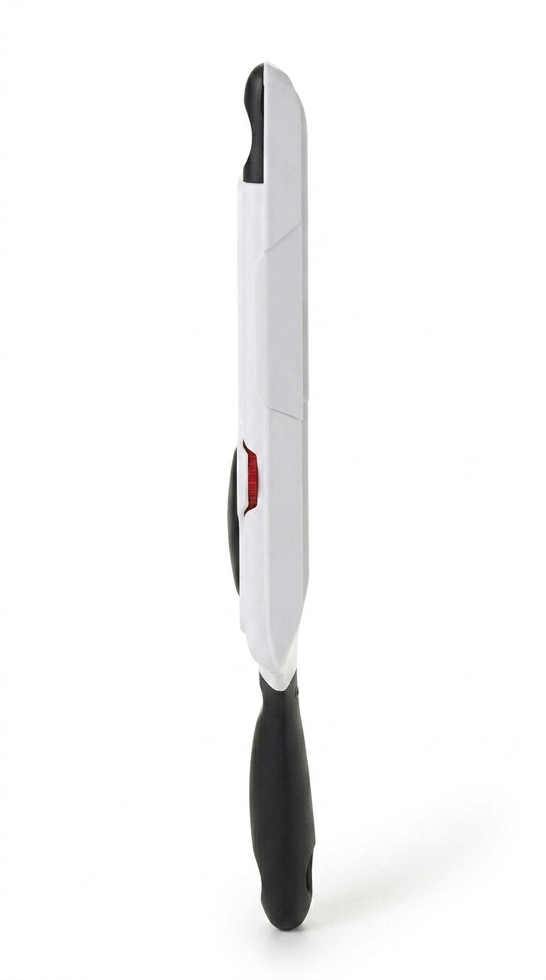 Handheld mandoline slicer with black handle, studio shot