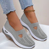 Mesh slip-on walking flats in Gray, worn