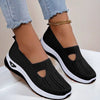 Mesh slip-on walking flats in Black, worn