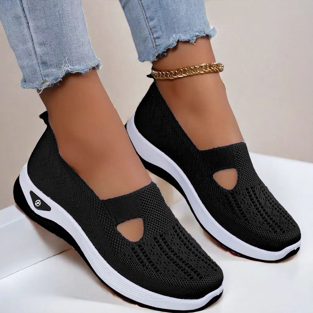 Mesh slip-on walking flats in Black, worn