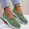 Mesh slip-on walking flats in Army Green, worn