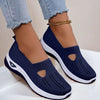 Mesh slip-on walking flats in Blue, worn