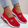 Mesh slip-on walking flats in Red, worn