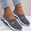 Mesh slip-on walking flats in Dark Gray, worn