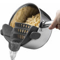 Clip-on silicone pot strainer draining pasta from a pot