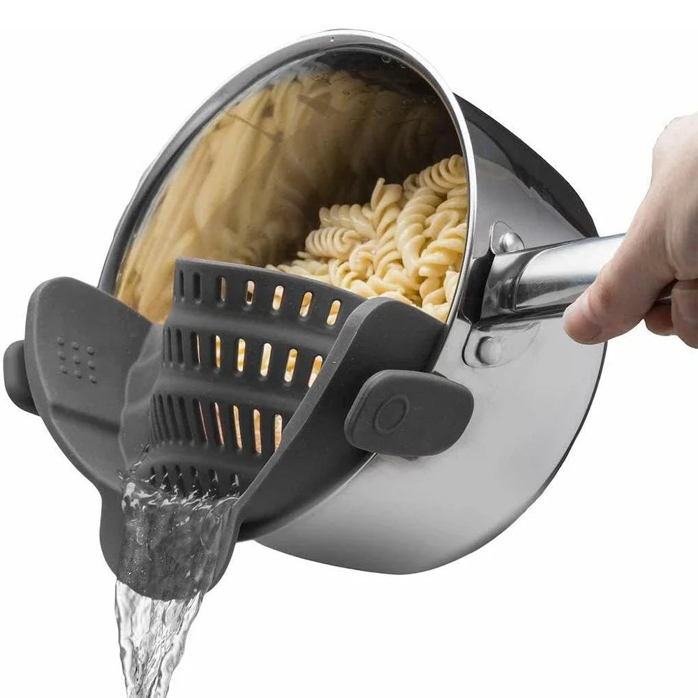 Clip-on silicone pot strainer draining pasta from a pot