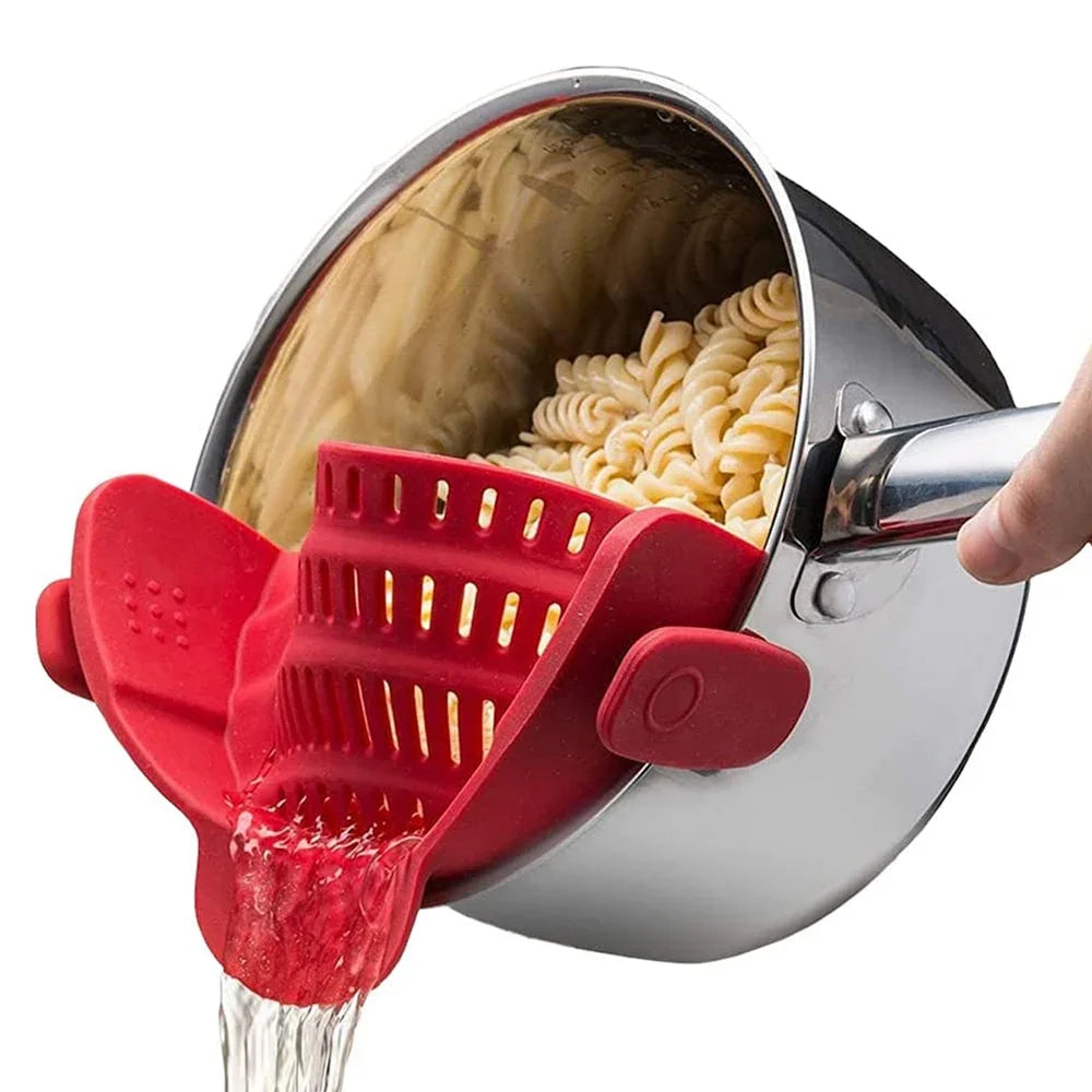 Red clip-on pot strainer draining pasta