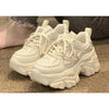 Womens beige chunky platform sneakers - pair, three-quarter view