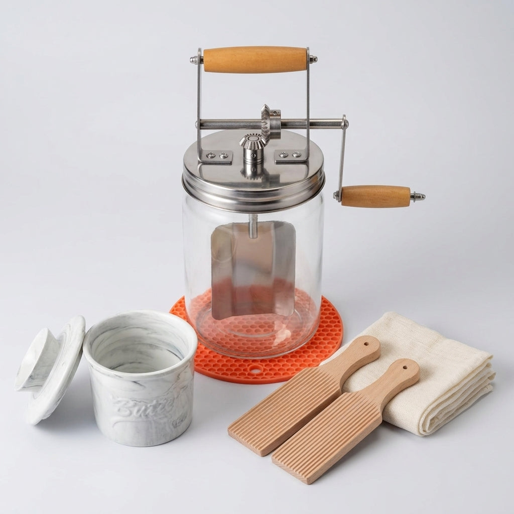 Glass butter churner with wooden paddles and crock, studio shot