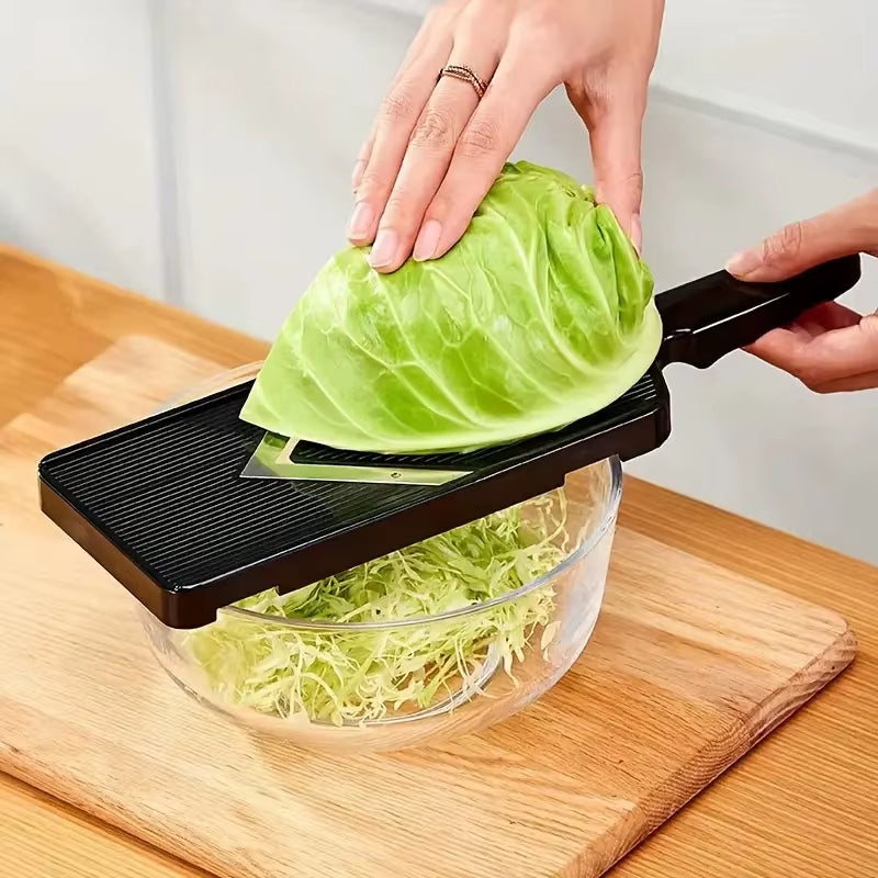 Cabbage shredder in action — slicing purple cabbage into thin strips