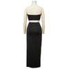 Back view of black bandeau top and maxi skirt set on mannequin