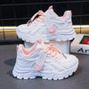 Kids white sneakers styled product photo, both colorways