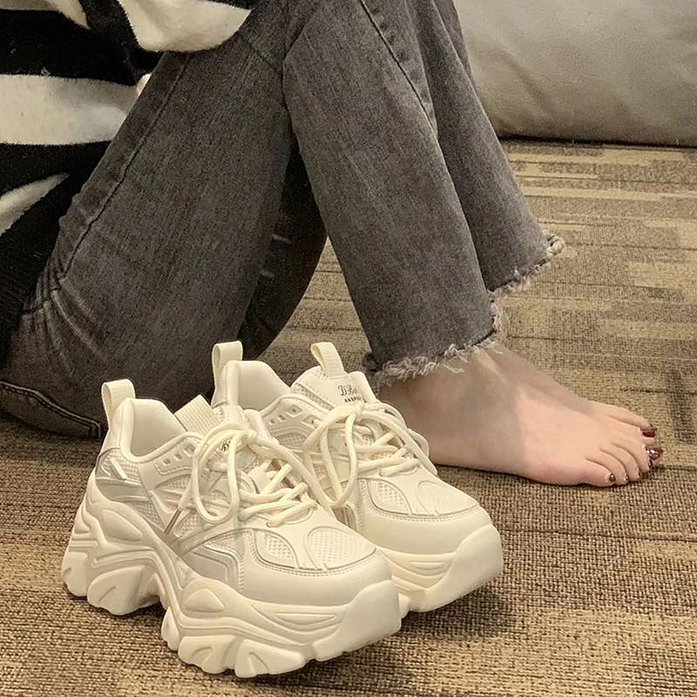 Beige chunky platform sneakers styled photo