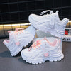 Kids white sneakers styled product photo, three angles