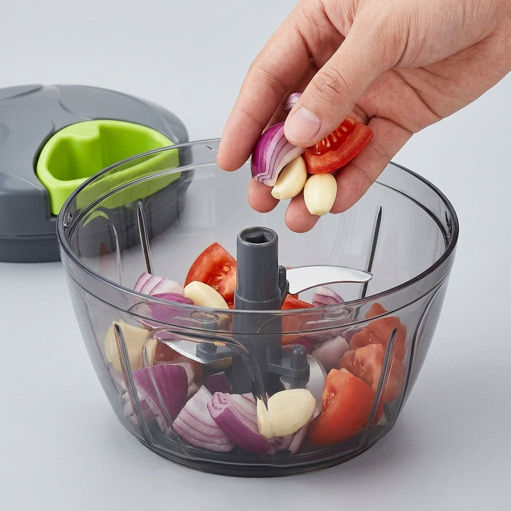 Hand pulling the green cord to chop vegetables in seconds, no electricity