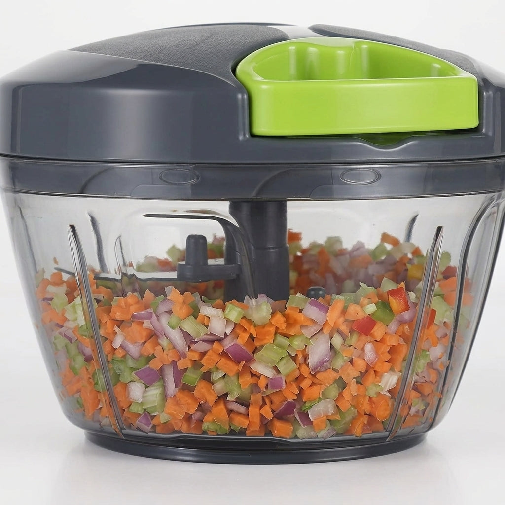 Bowl of finely chopped vegetables next to a fresh salad, manual food chopper