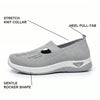 Side profile infographic showing the stretch knit collar, heel pull-tab and gentle rocker shape