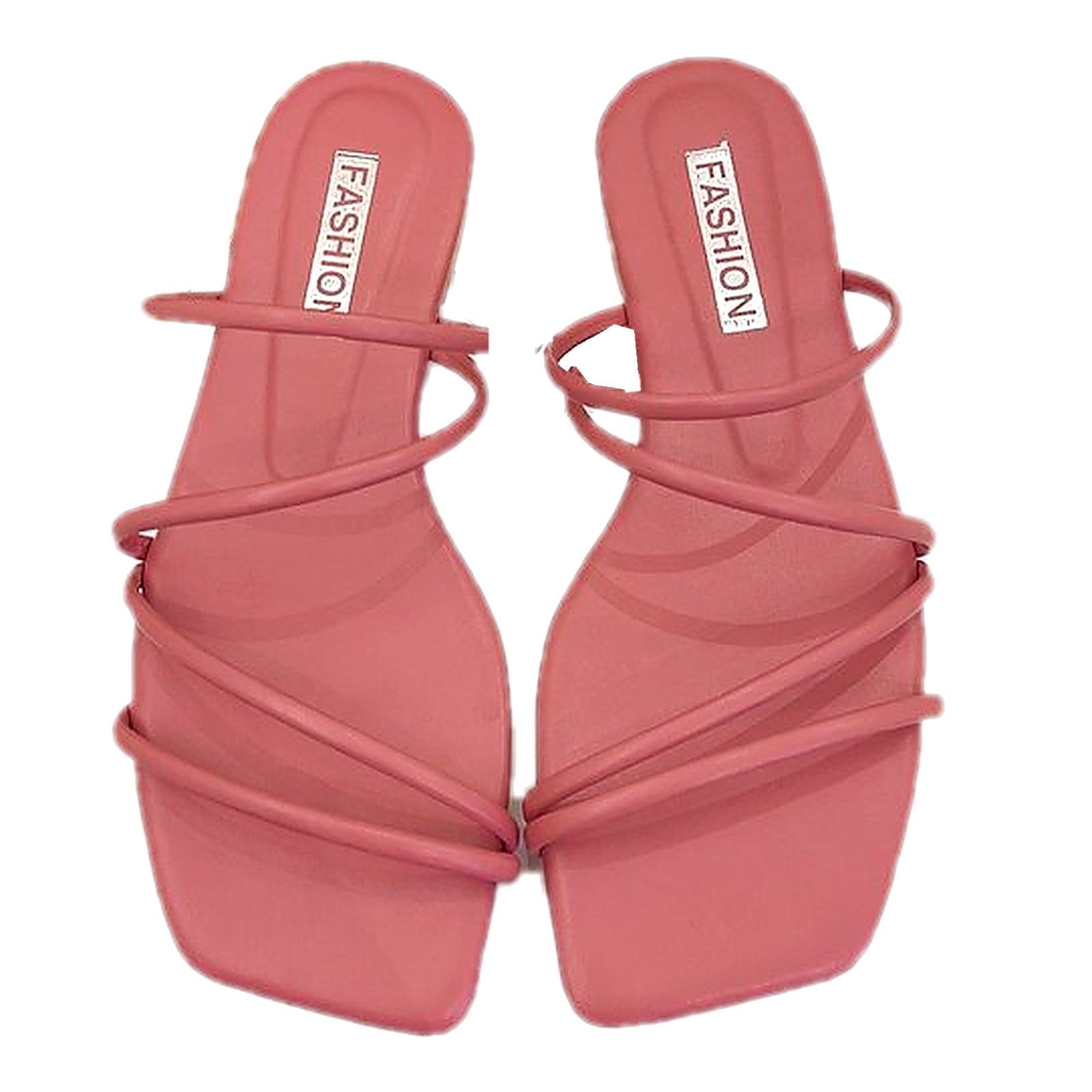 Pair of pink square toe strappy flat slide sandals on white background